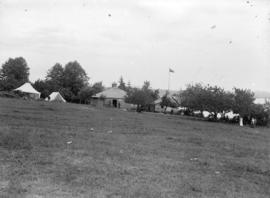 [Cottages and tents on Tom Turner's orchard, Moodyville (North Vancouver)]