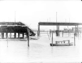 [Fire damaged section of Connaught Bridge (Cambie Street Bridge) collapsed into False Creek]