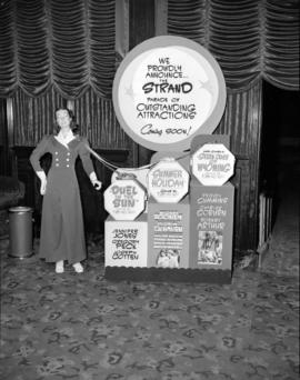 [Movie advertising display at the Strand Theatre]