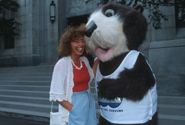 Tillicum with woman outside entrance at Vancouver City Hall