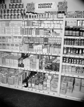 [Household remedies and food products display at a grocery store]