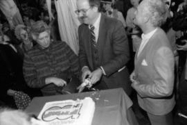 Pat Carney and Mike Harcourt cut cake