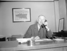 Mr. H.R. Stevenson in his office