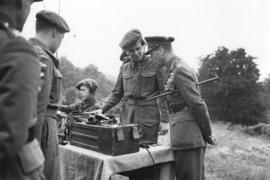 [His Majesty The King inspecting cadet's wireless telegraph equipment at the camp at "Alders...