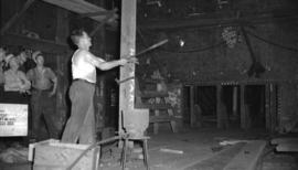 [Man working on ship at Burrard Drydocks]