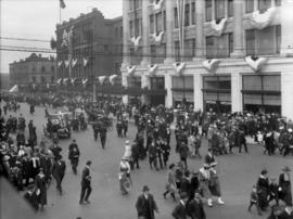 [Looking west on Georgia Street showing crowds dispersing after a parade]