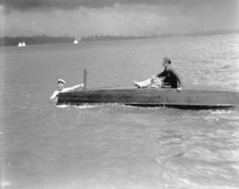 Yachting at English Bay during Regatta [two men with capsized boat]