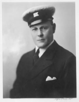 Eric W. Hamber in yachting hat and eyeglasses