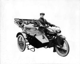 [Alfred T. Layne, actor, on a motorcycle with sidecar]