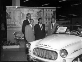P.N.E. President J.F. Brown, Past President W.J. Borrie, and others with model Skoda Felicia car