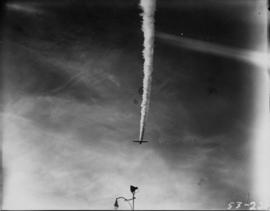 Plane flying over P.N.E. grounds in Aviation and Transportation Day fly past event