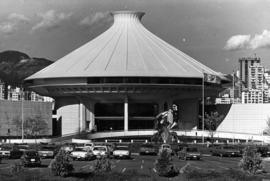 Centennial Museum and Planetarium complex with mountains in background