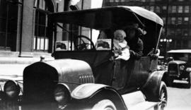 Audrey Gowe and her mother, Flora in front of CPR station on Dominion Day, first car, 1925