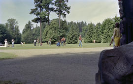 Groups assembled around totem poles