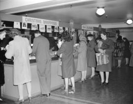 Hudson Bay Company - [people browsing display in] wrapping aisle