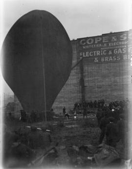 [A hot air balloon being inflated during a carnival on the Cambie Street grounds]