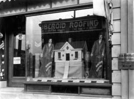 [Johnson and Salsbury's window at 90 Lonsdale Avenue showing a display for Ruberoid Roofing]