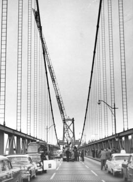 Vancouver Fire Department inhalator man Len Erlendson removes person from First Narrows Bridge la...