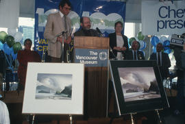 Michael Francis and Toni Onley at the podium during Vancouver's 99th birthday celebration