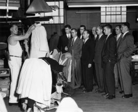 Group of men on a tour of the Nelson's Laundry plant