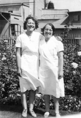 Jean and Elsie in front of greenhouse