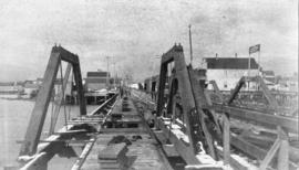 [A trestle bridge under construction over False Creek for the street railway]