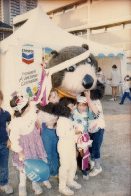 Tillicum posing with group of children