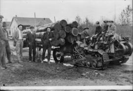 Copy for B.C. Tractor [Copy of photograph of log tractor with a load of logs, children sitting on...