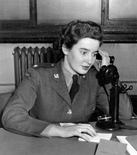 [A member of the Canadian Women's Army Corp answering the telephone]