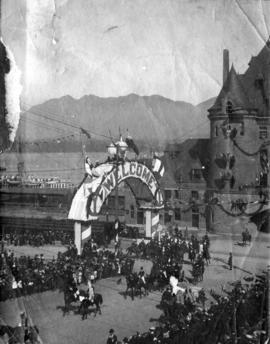 C.P.R. Station "Welcome" arch and procession of Duke and Duchess of Cornwall and York a...