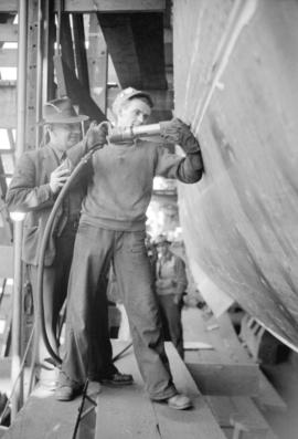 [Men at work on boat at Burrard Drydocks]