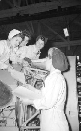 [Women working on airplane at the Boeing plant on Sea Island]