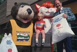 Tillicum and MacTavish with a child and Mayor Harcourt