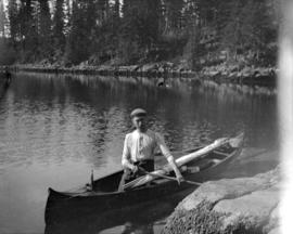 [Man in a canoe]