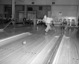 [Bowler in action]