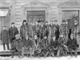 [Staff outside the Canadian Imperial Bank of Commerce]