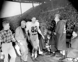 [Montreal Alouette Joey Pal is led off the field after an injury during the Grey Cup game]