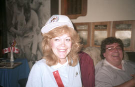 Charlotte Baynes wearing a Centennial hat and red ribbon