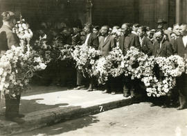 [Men holding wreaths for Yip Sang funeral procession]