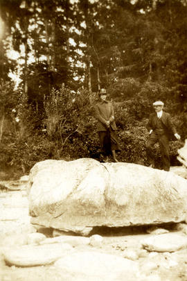 [L.D. Taylor and an unidentified woman standing on a large rock]