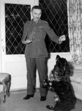 Brigadier Sherwood Lett at home with dog