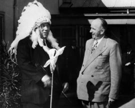 Mayor C.E. Thompson presenting headdress to Lord Mayor Ernest O'Dea of Sydney