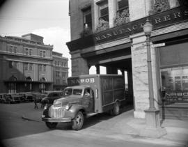 [Nabob delivery truck leaving a building at Cordova and Water Street]