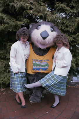 Tillicum with two Centennial staff wearing Centennial tartan