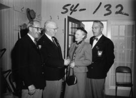 P.N.E. President J.S.C. Moffitt, Past President G.M. Ferguson, and director A.W. Gross at tea party