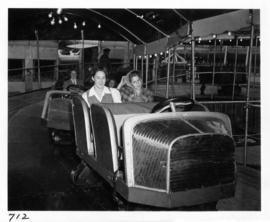 Women on amusement ride in midway