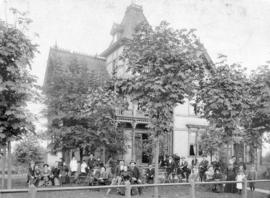 [Group portrait in front of boarding house at 708 Cambie Street]