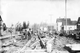 [Men building streetcar tracks on Powell Street, between Hawks and Campbell Streets]