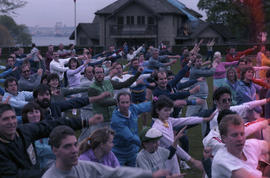 Crowd participates in group fitness exercises