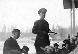 Harry Gale [and military officer in grandstand]